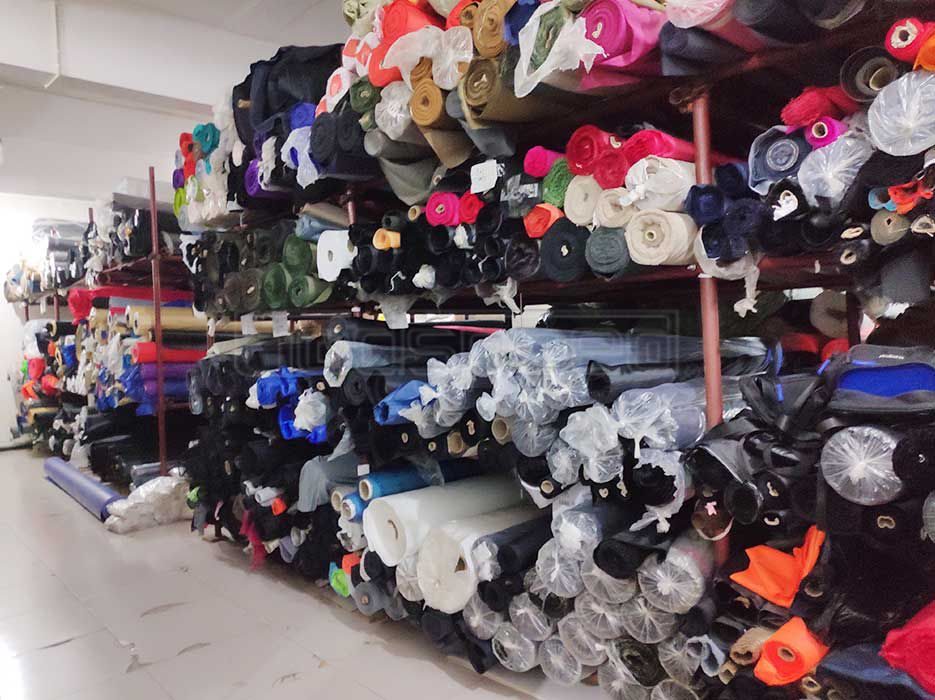 Fabric and raw material management for custom bag production
